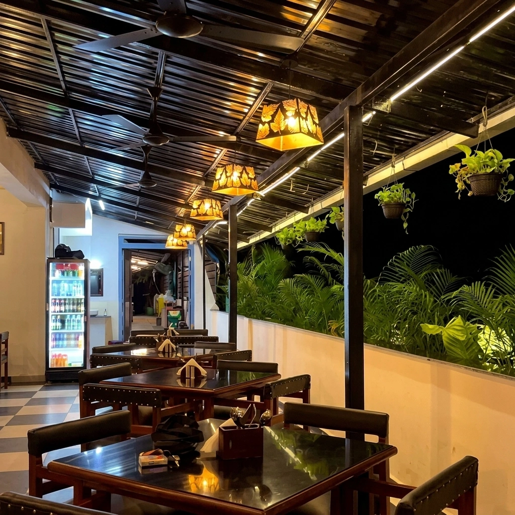 The covered terrace after dark, lanterns down the length of it